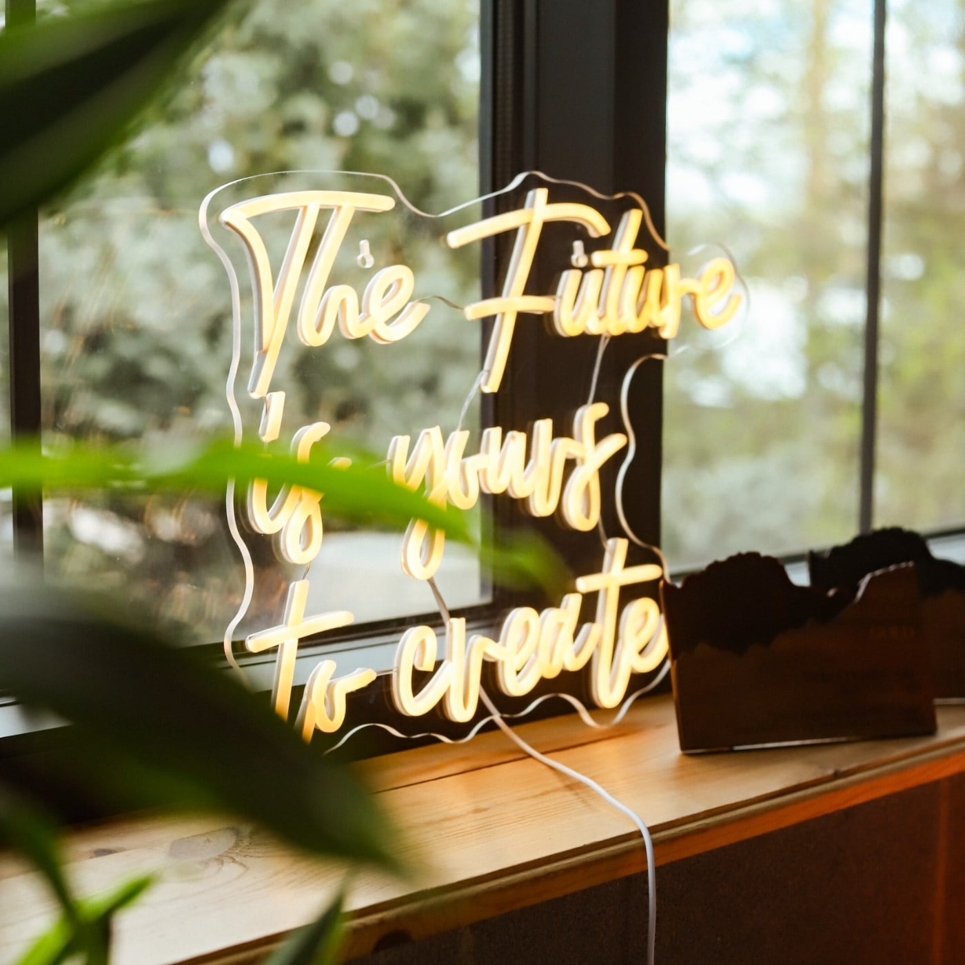Neon sign that says "The future is yours to create"